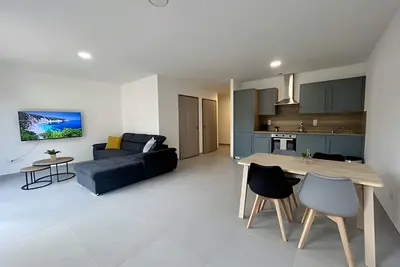 Image de Logement neuf en rez-de-jardin avec parking à 20 min de Lyon