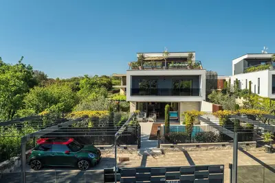 Image de Modern villa with private pool, jacuzzi, kids playground, and gym.