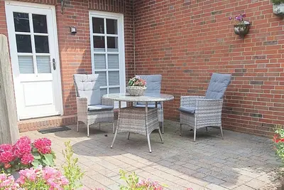 Image de Appartement 'Ferienhof Jacobsen 4' avec terrasse privée, jardin partagé et Wi-Fi