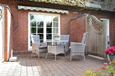 Image de Appartement 'Ferienhof Jacobsen 5' avec terrasse privée, jardin partagé et Wi-Fi