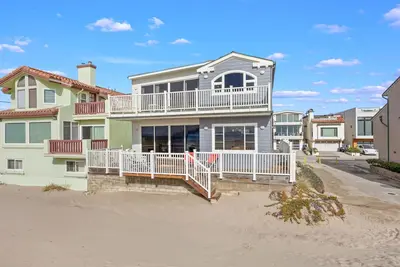 Beachfront abode with spacious deck, pool table, gas grill, smart TVs, & W/D