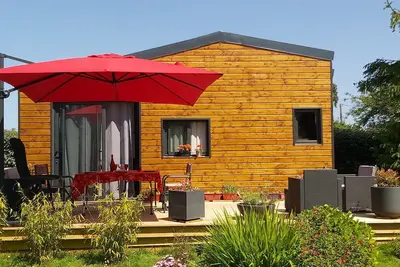 Image de Maison de vacances 'Tiny House' avec terrasse privée et jardin partagé