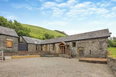 Image de Ty Carreg is a stunning barn conversion with views over the rolling hills near Aberystwyth.