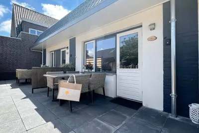 Image de Four-person holiday home with a beautiful location near the beach and dunes