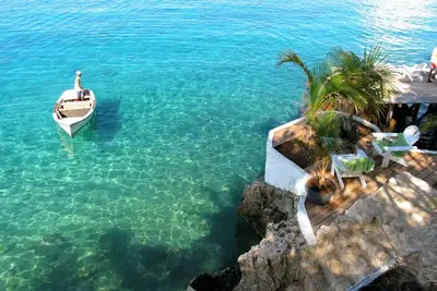 Oceanfront Caribbean styled bungalow situated on a clip above the Caribbean Sea.