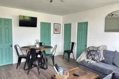 Our cosy chalet is just a 5-minute stroll from the golden sands of Camber Beach.