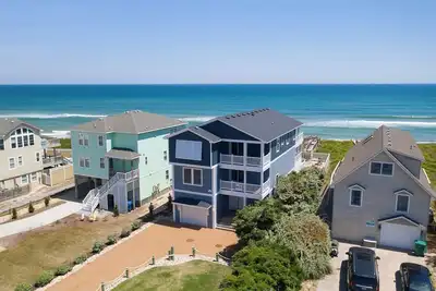 Duck oceanfront home with theater room and elevator, steps from the beach!
