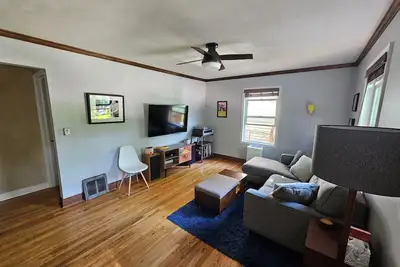 Image de 2-bedroom home w/ deck, private backyard, and outdoor fireplace.