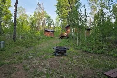Image de Cozy one room cabin and outhouse tucked in the woods with your own private site.