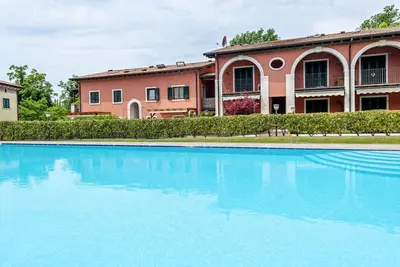 Image de Appartement 'Residence Corte La Fiorita' avec piscine partagée, Wi-Fi et climatisation