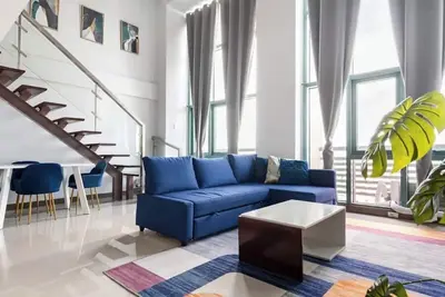 Image de Cozy Loft Apartment in Eastwood City - 5 mins walk to the mall, with pool & gym!