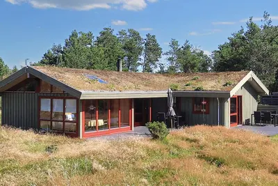 Image de Maison de vacances pour 6 a Blokhus-By Traum