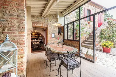 Image de Appartement 'Rosso Poggiolo' avec piscine partagée, jardin privé et Wi-Fi
