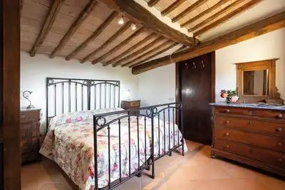 Image de Attic room with exposed beams, rustic Tuscan style