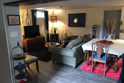 Image de Large private fenced yard with guest patio, fire pit and surrounding gardens.