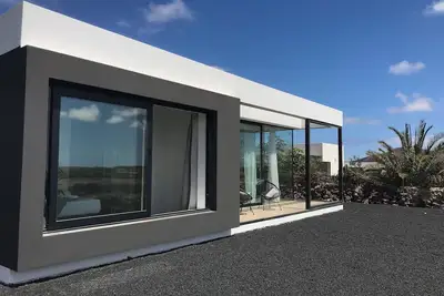 Lajares Volcanovilla. New, designer, minimalist with panoramic views.