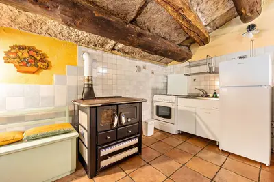 Image de Appartement 'Appartamento Del Vecchio Fienile' avec vue sur les montagnes et jardin partagé