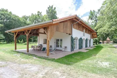 Image de Maison de plain-pied pour 6 dans un superbe parc forestier au bord du lac