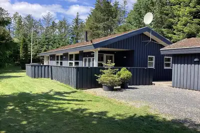 Image de Maison de vacances pour 8 a Blokhus-By Traum