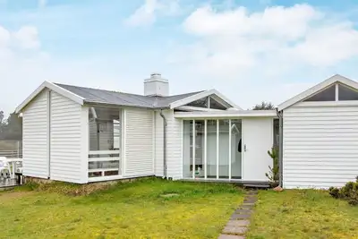 Image de Maison de vacances pour 4 a Blokhus-By Traum