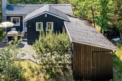 Image de Maison de vacances pour 4 a Blokhus-By Traum