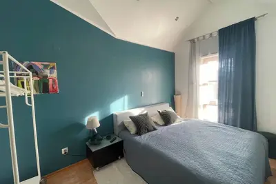 Quietly located villa with 2 apartments on the outskirts of town with private parking space