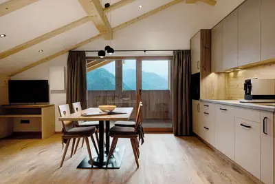 Image de Appartement 'Fën' avec vue sur les montagnes, jardin partagé et Wi-Fi