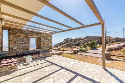 Image de Maison de vacances 'Stelios Cave House' avec vue sur la mer, terrasse privée et Wi-Fi