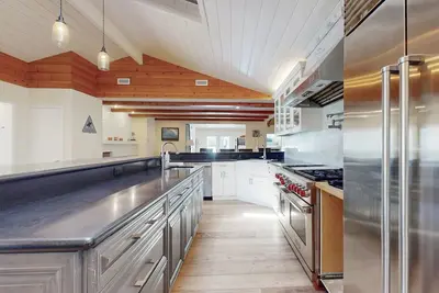Dog-friendly home near downtown & beach with private heated pool, spa, & grill