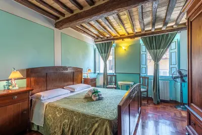 Chambre \"Camera Verde\" avec terrasse partagée et Wi-Fi