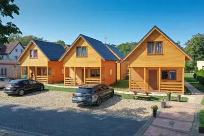Image de Słoneczne Domki Pustkowo, 1 Minute zum Strand