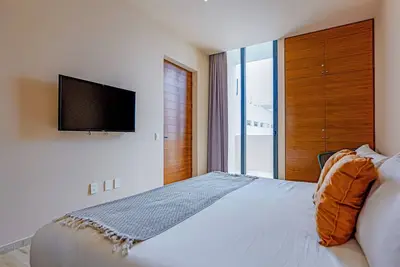 Luxury studio with resort amenities, balcony, and WiFi