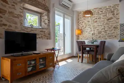 Image de At077 Mèxic: Apartamento en planta baja con jardín, muy bien equipado (A/A, wifi, barbacoa, aparcamiento) a 600m de la playa