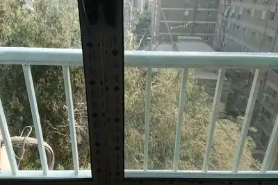 Image de Cozy 2-bedroom apartment in pleasant Mohandesin with WiFi, Ac