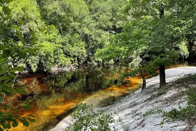 Image de Riverfront camp sites near Wing, Al Bring your Rv or Tent. 30 Amp Full Hookups.