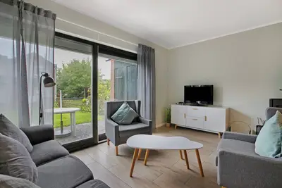 Image de Maison de vacances 'Ferienhaus Deichkönig' avec vue sur le lac, terrasse privée et Wi-Fi