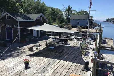 Charming garden  cottage located on Little River East Boothbay directly on wharf