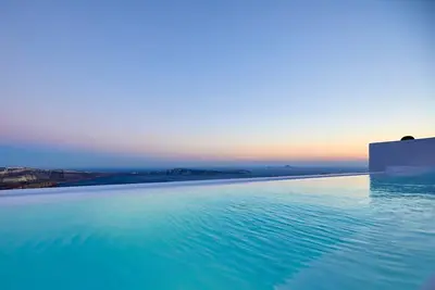 Charming Santorini Apartment | Gaderois Apartment | 2 Bedrooms | Private Furnished Terrace with Outdoor Heated Pool with Spectacular Caldera and Volcano Views | 25is Martiou, Imerovigli