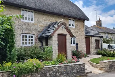 Image de The Old Post Office, annex with bedroom, onsuite and lounge with kitchenette.