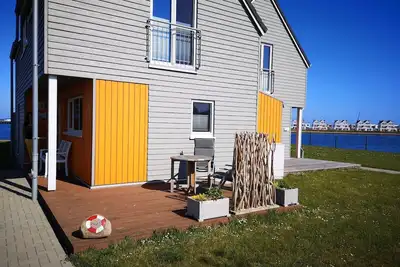 Image de Koje 23 - 1st row by the water, fireplace, shower, washing machine, parking spac