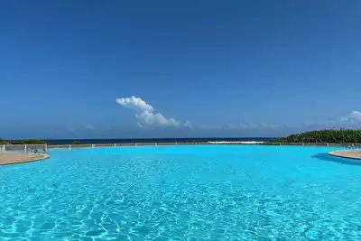 Image de Appartement dans quart de villa dans jardin tropical