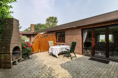 Image de Appartement 'Ferienhaus Alter Deich' avec terrasse privée, jardin privé et Wi-Fi