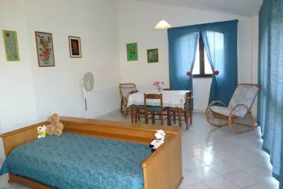 Image de Rilassati nella Nostra Suite Angelica: Un Ambiente Familiare Vicino al Centro