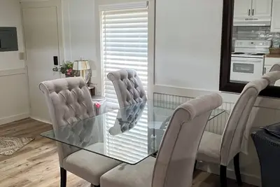 Image de Completely renovated mobile home sitting own a pond.