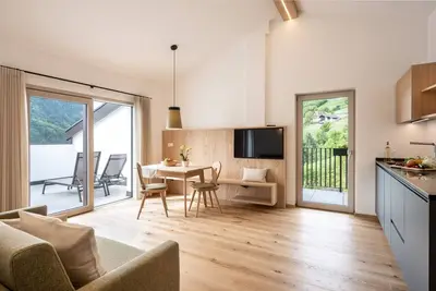 Image de Appartement 'Müller' avec vue sur les montagnes, piscine partagée et Wi-Fi