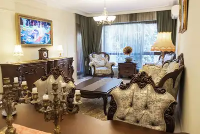 Image de One-of-a-kind apartment seamlessly blends antique elegance with modern comfort.