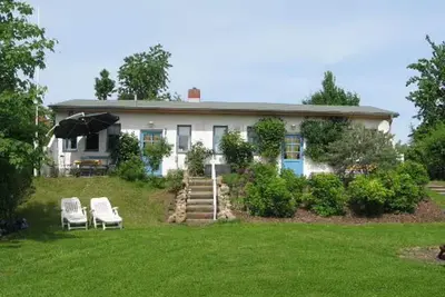 Image de Appartement 'Landhaus Strietfeld-Ferienwohnung 1' avec vue sur le lac, terrasse et jardin partagés