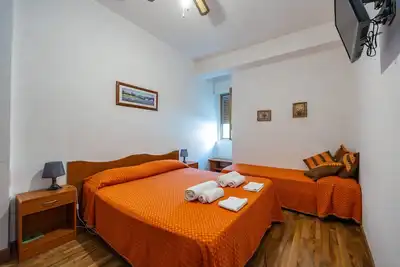 Image de Appartement 'Appartamento 3 - Stanza 32' avec terrasse partagée, Wi-Fi et climatisation