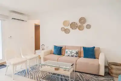 Cozy and coastal condo with private W/D, shared pool, and WiFi