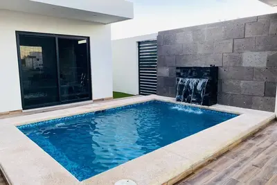 Luxury minimalist 3-bedroom house welcoming you with a private pool.